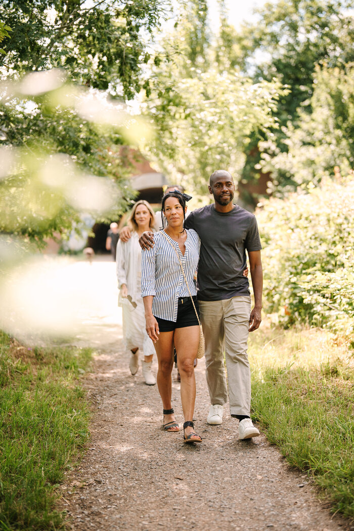 Classic models walking and laughing by river