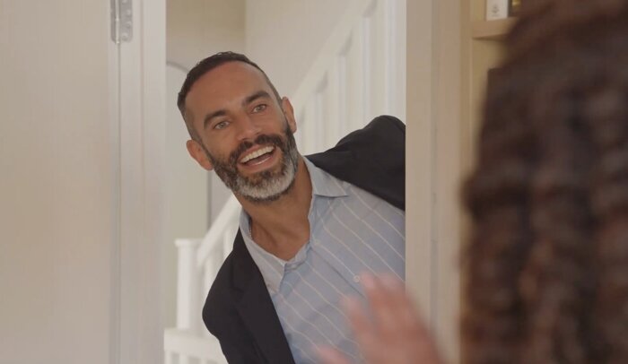 Model Dad smiling at the doorway