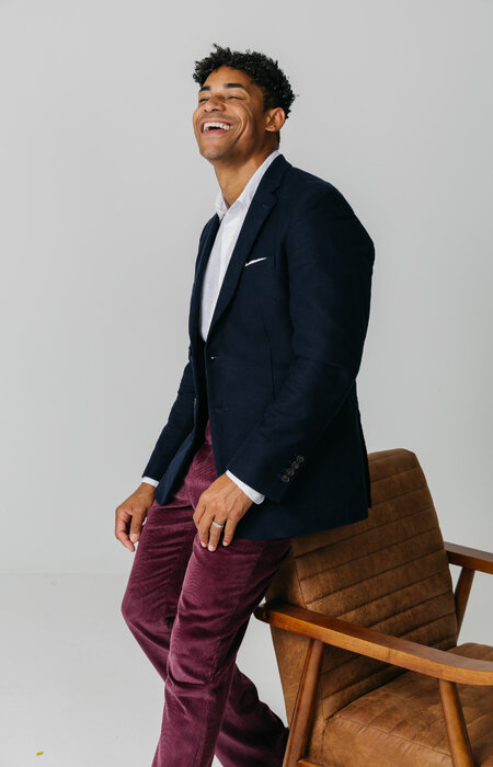 Male model with chair laughing