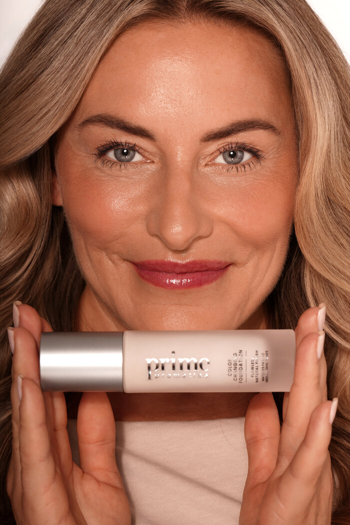 Model holding beauty product