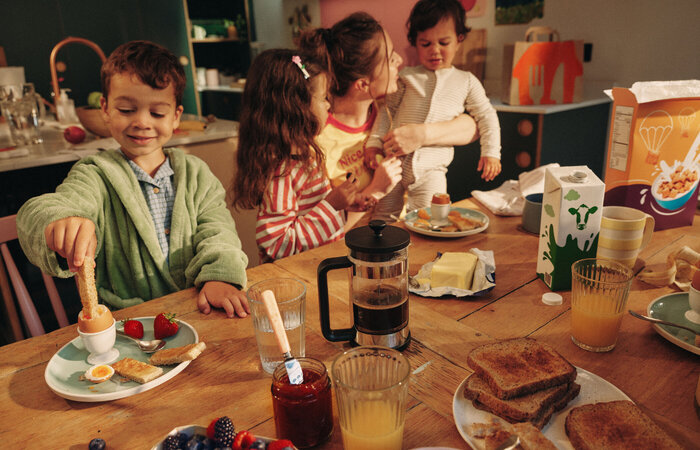 Model family having boiled egg and breakfast