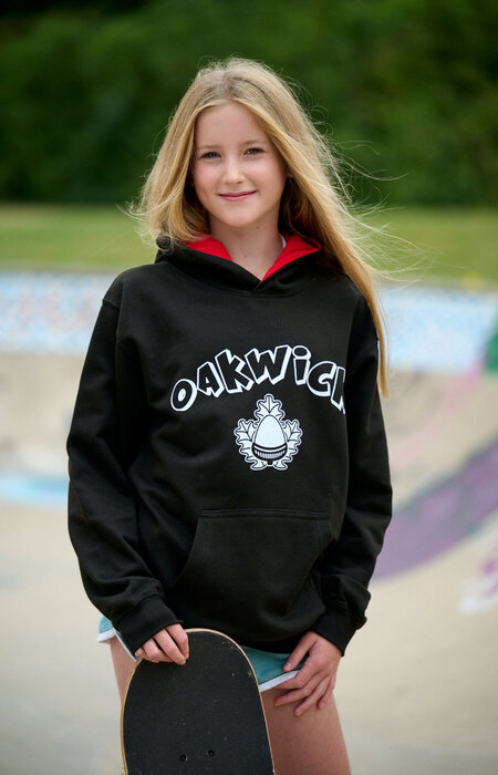 Junior model smiling with skateboard