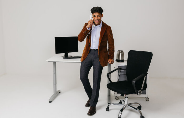 Male model on phone smiling