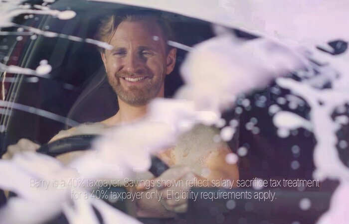 Actor in car covered with bubbles
