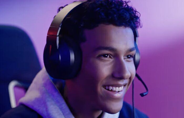 Junior model smiling wearing gaming headset