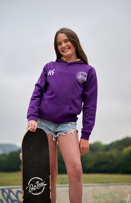 Junior model standing and smiling