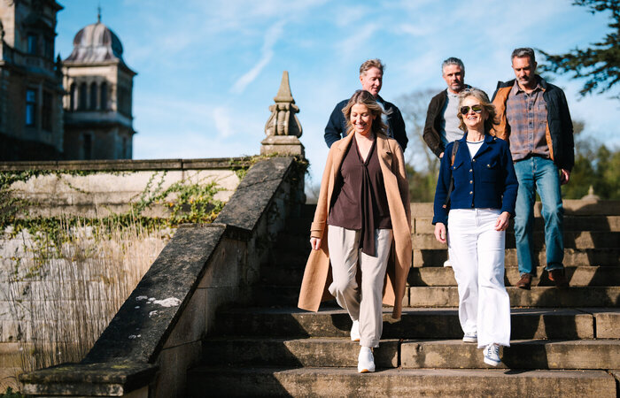 Group of models walking down stairs