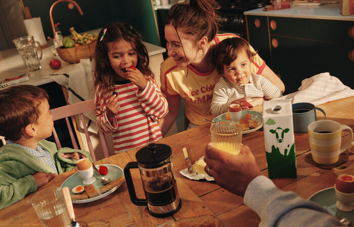 Model family having breakfast together