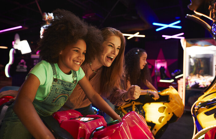 Mother and Daughter playing in arcades