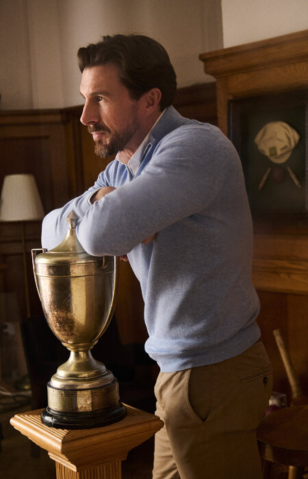 Classic model leaning on sporting cup