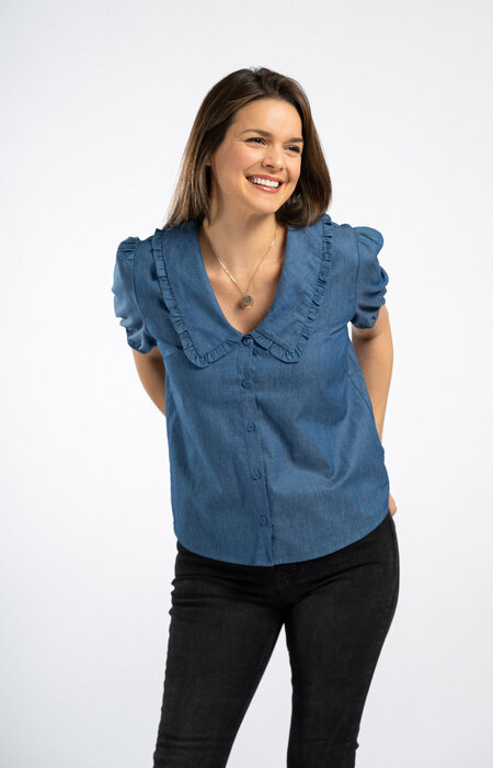 Model in studio in blue shirt