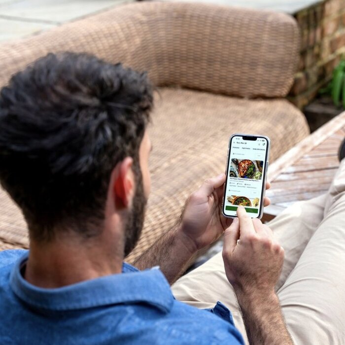 Male model placing order on phone