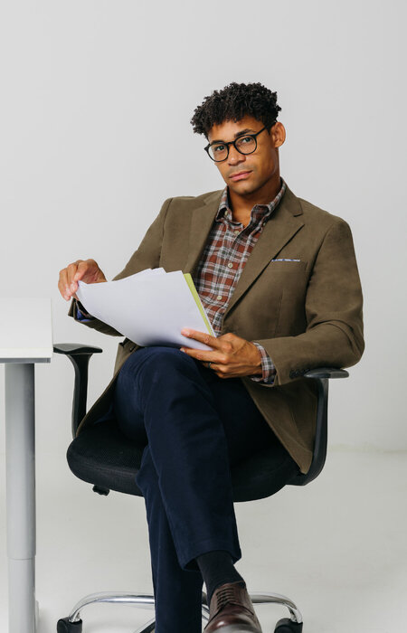 Male model sitting at desk