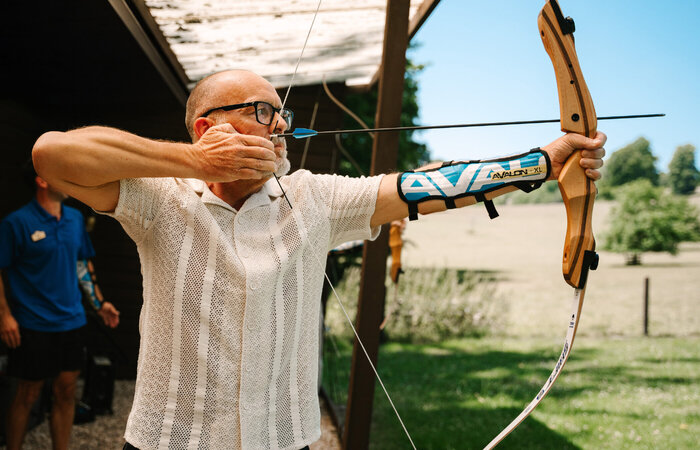 Male classic model doing archery