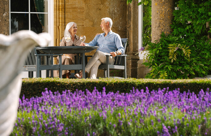 Classic models enjoying drinks in the garden