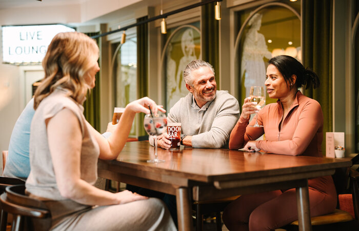 Models in a bar smiling