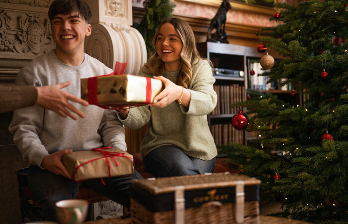 Models exchanging Christmas gifts