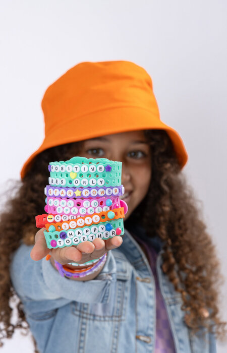 Junior model showing all the jelly bands in her hand