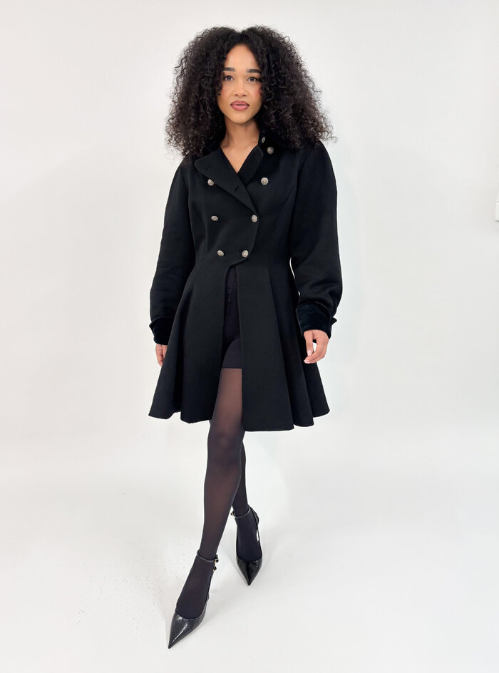 Female model in black coat