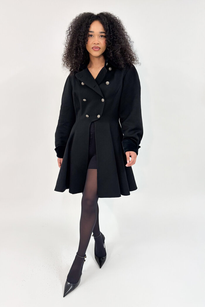 Female model in black coat