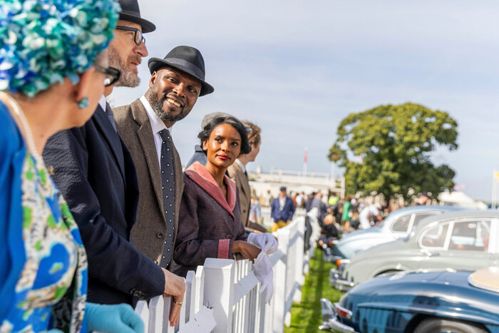 Model couple at vintage car show