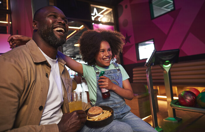 Father and Daughter enjoying food together