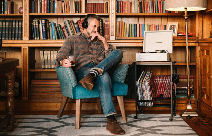 Male classic model listening to records