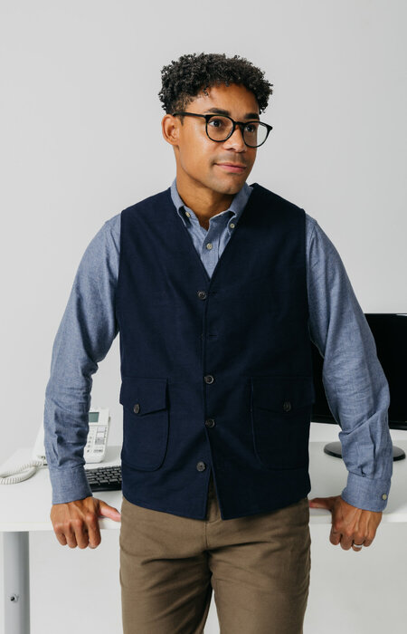 Male model in glasses by desk