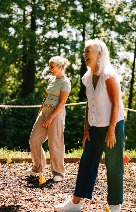 Two classic models laughing together