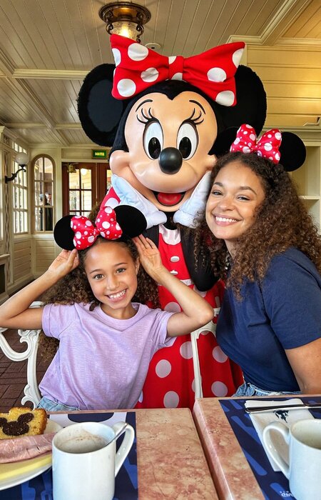 Mother and daughter with Minnie Mouse smiling