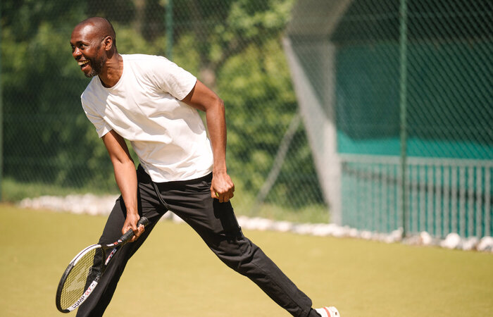 Male classic model playing tennis