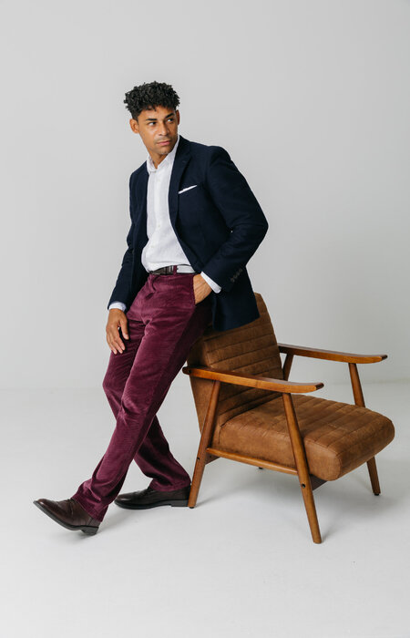 Male model leaning on chair
