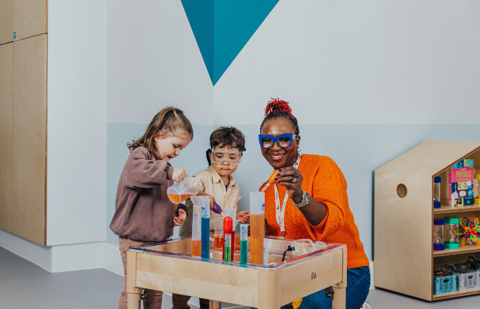 Children learning science with teacher