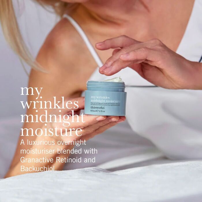 Hand model with pot of skin cream