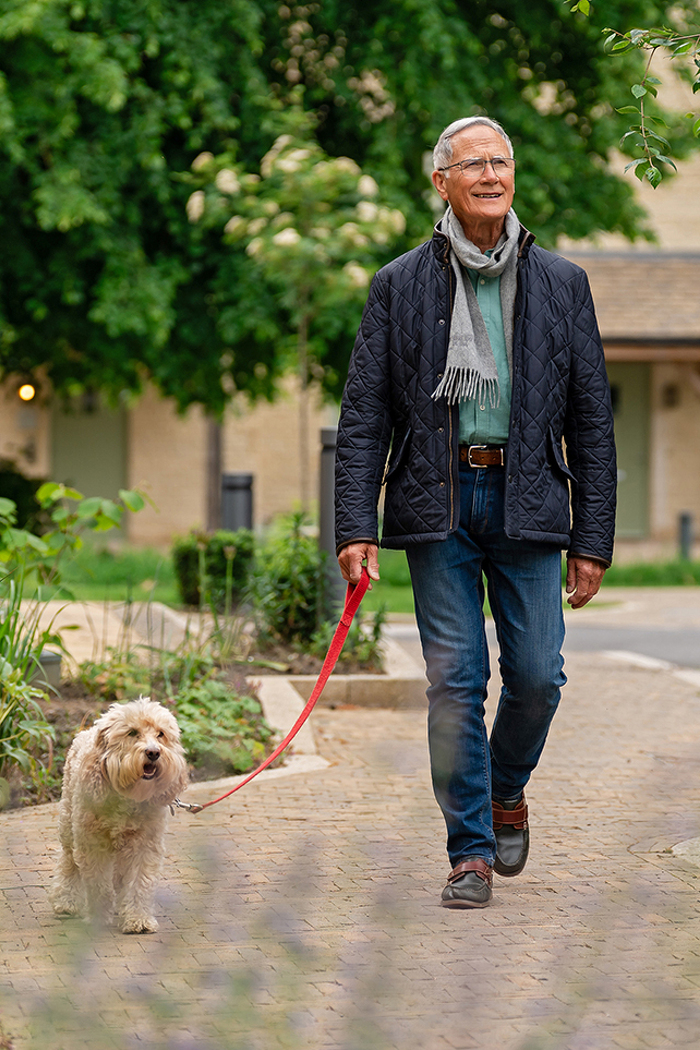 Gentleman walking dog