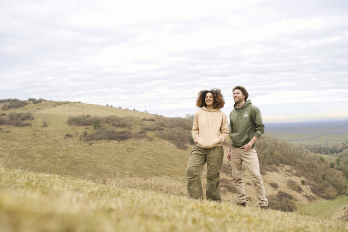 Couple standing laughing in the hills