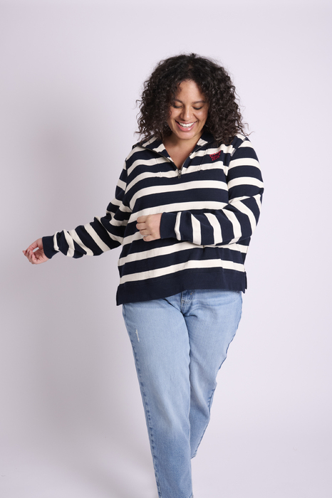 Female curve model wearing striped sweater