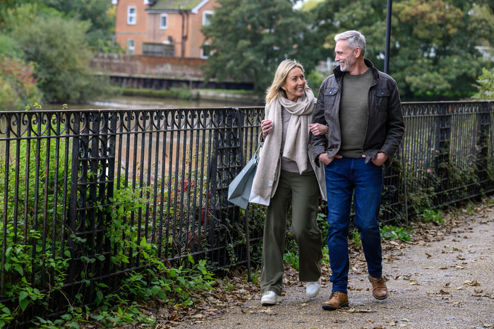 Couple walking arm in arm