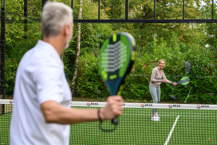 Couple playing tennis