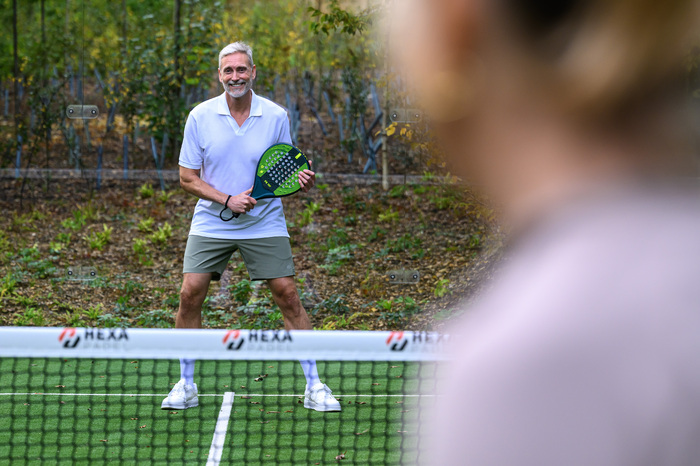 Couple playing tennis