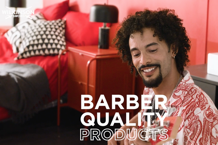 Male model smiling and playing guitar