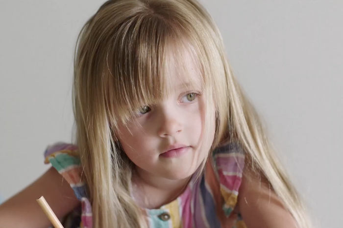 Young girl writing