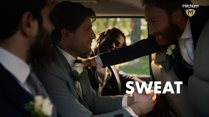 Group of men in wedding car
