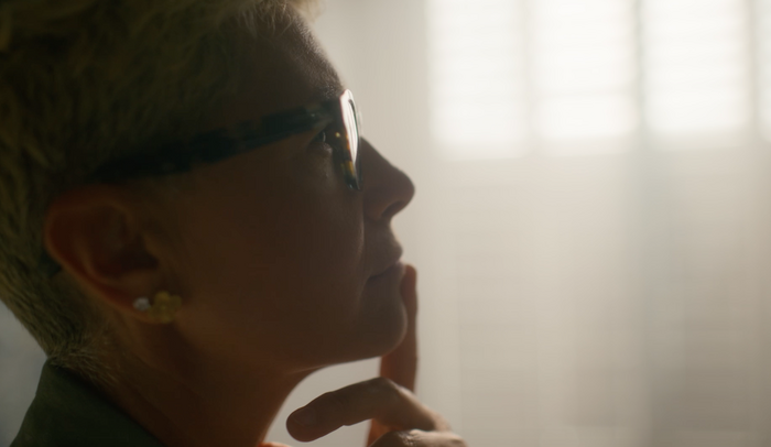Lady thoughtful with finger on chin