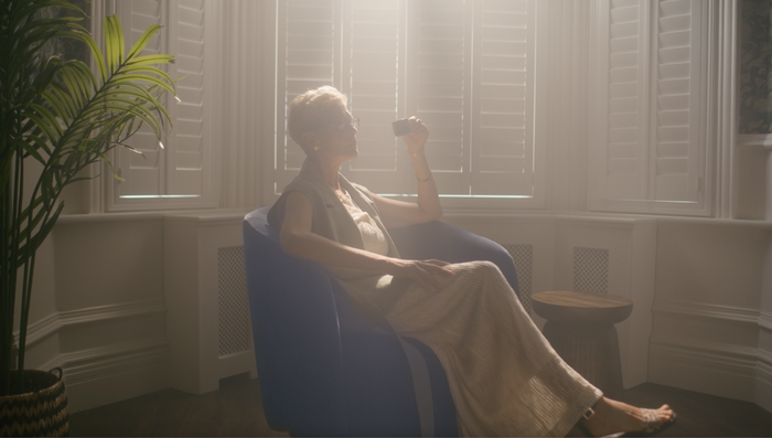 Mature lady drinking from tea cup