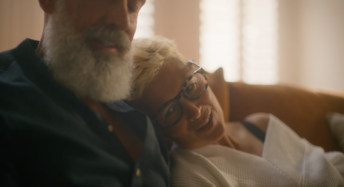 Mature couple lady resting head on mans shoulder