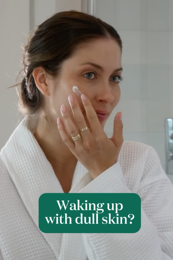 Female model applying face oil