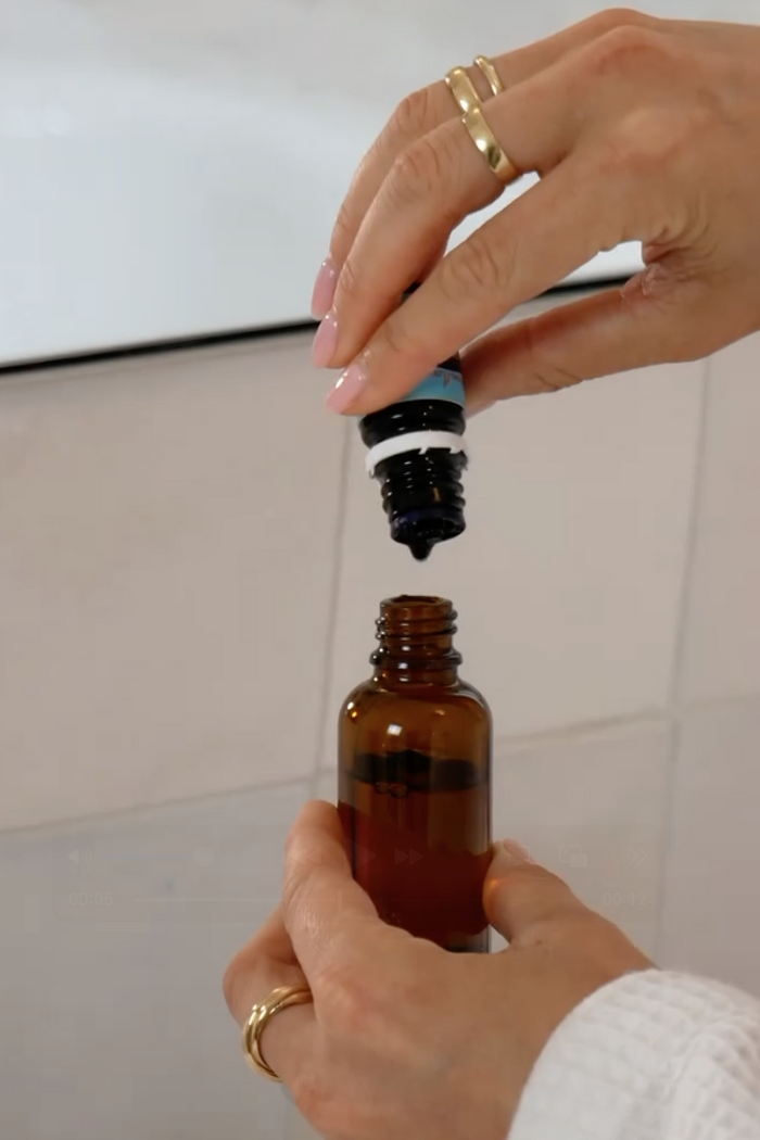 Hand model demonstrating essential oil mixing